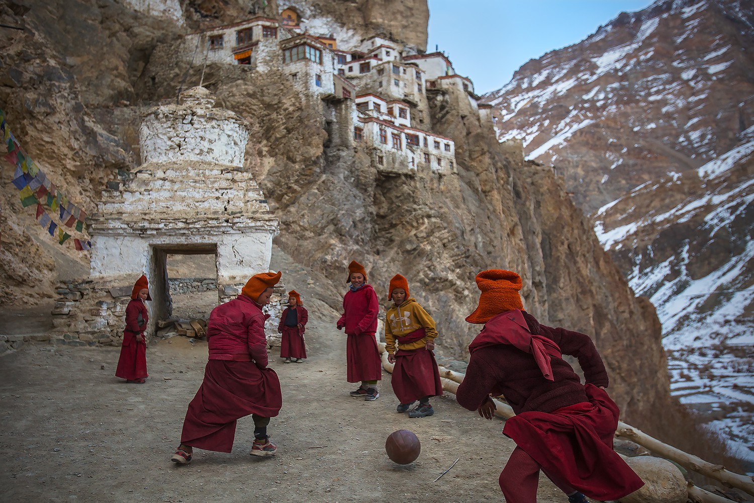 Young Monks Playing Football