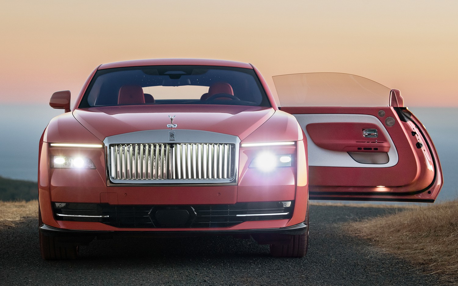 Dusty coral Rolls-Royce Spectre car